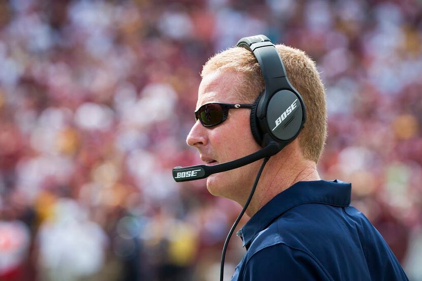 Dallas Cowboys head coach Jason Garrett watches from the sidelines during the second half of...