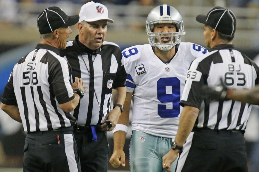 Dallas Cowboys quarterback Tony Romo (9) argues with officials over a call in the first half...