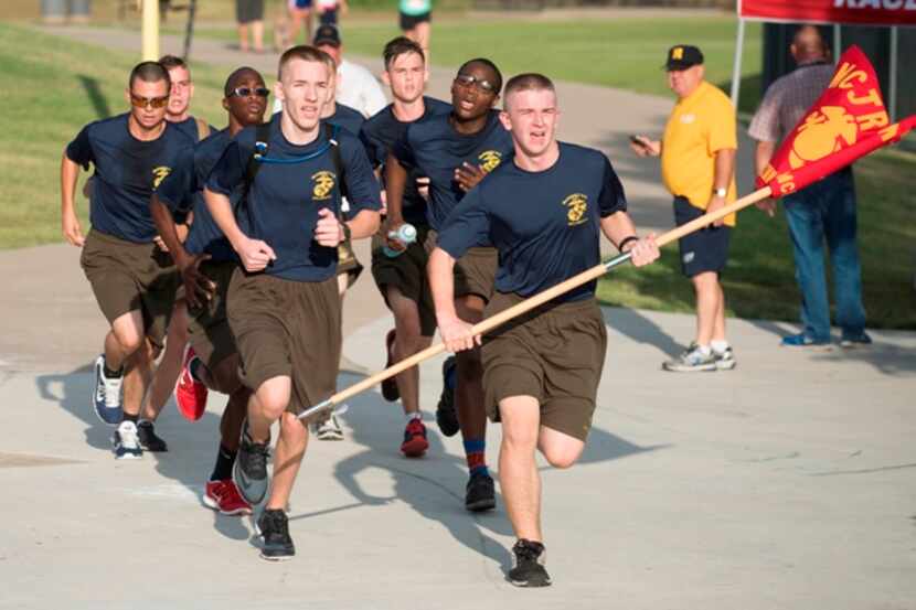  Marine JROTC members from McKinney High School approach the finish line of the 9/11 Heroes...