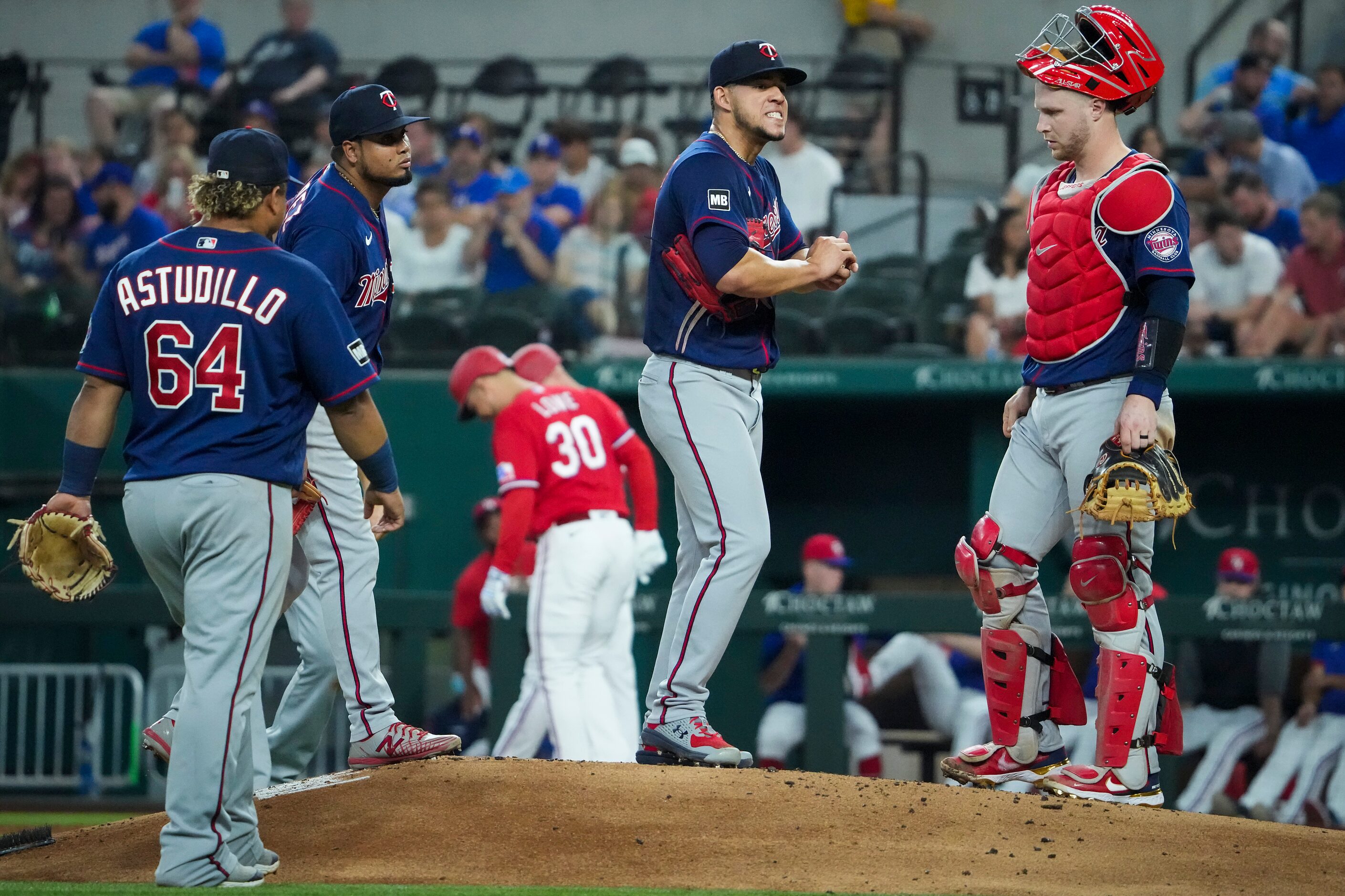 Minnesota Twins starting pitcher Jose Berrios gets a visit from catcher Ryan Jeffers after...