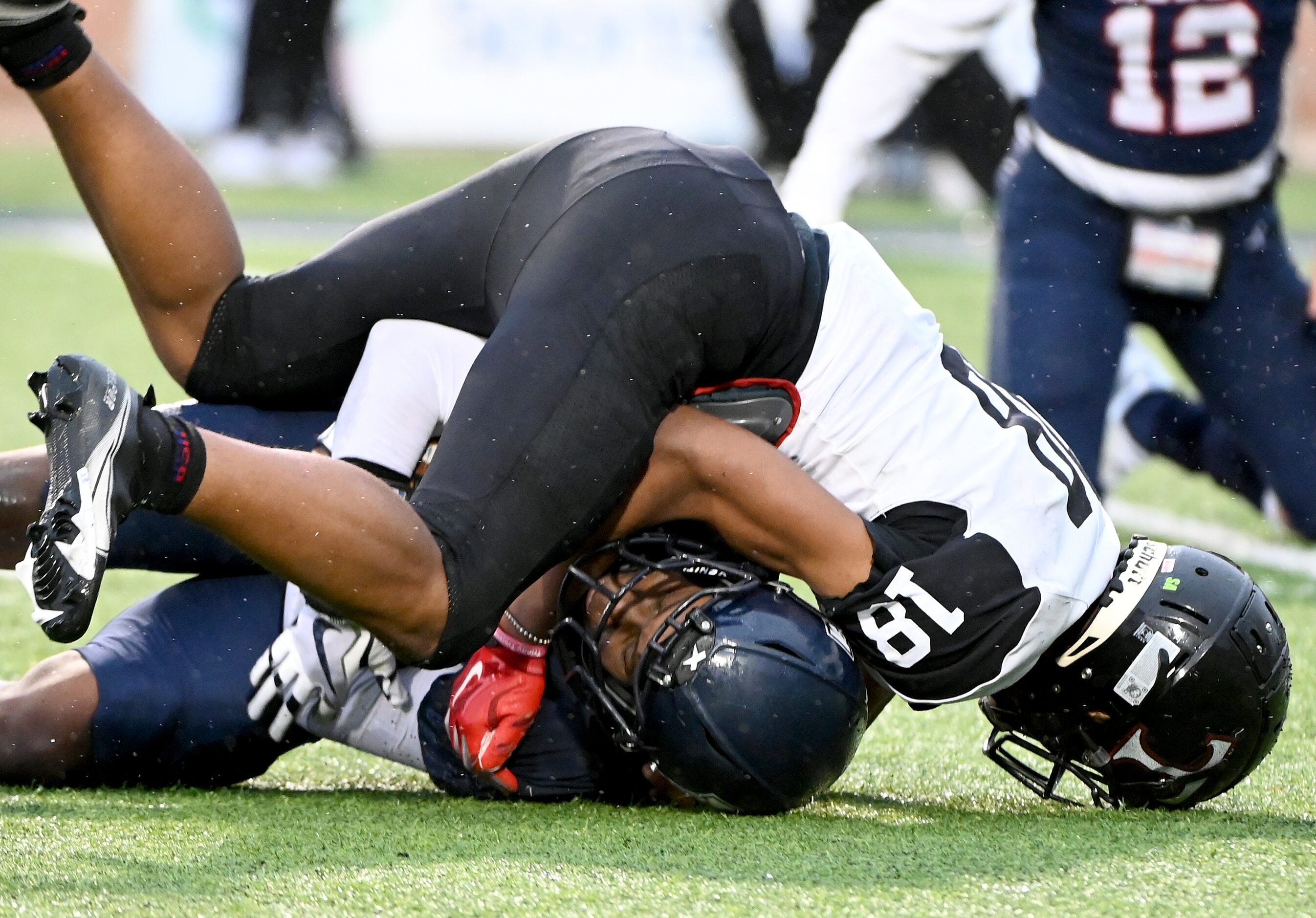 Allen’s Michael Momoh (22) intercepts a pass indented for Euless Trinity's Nasir...