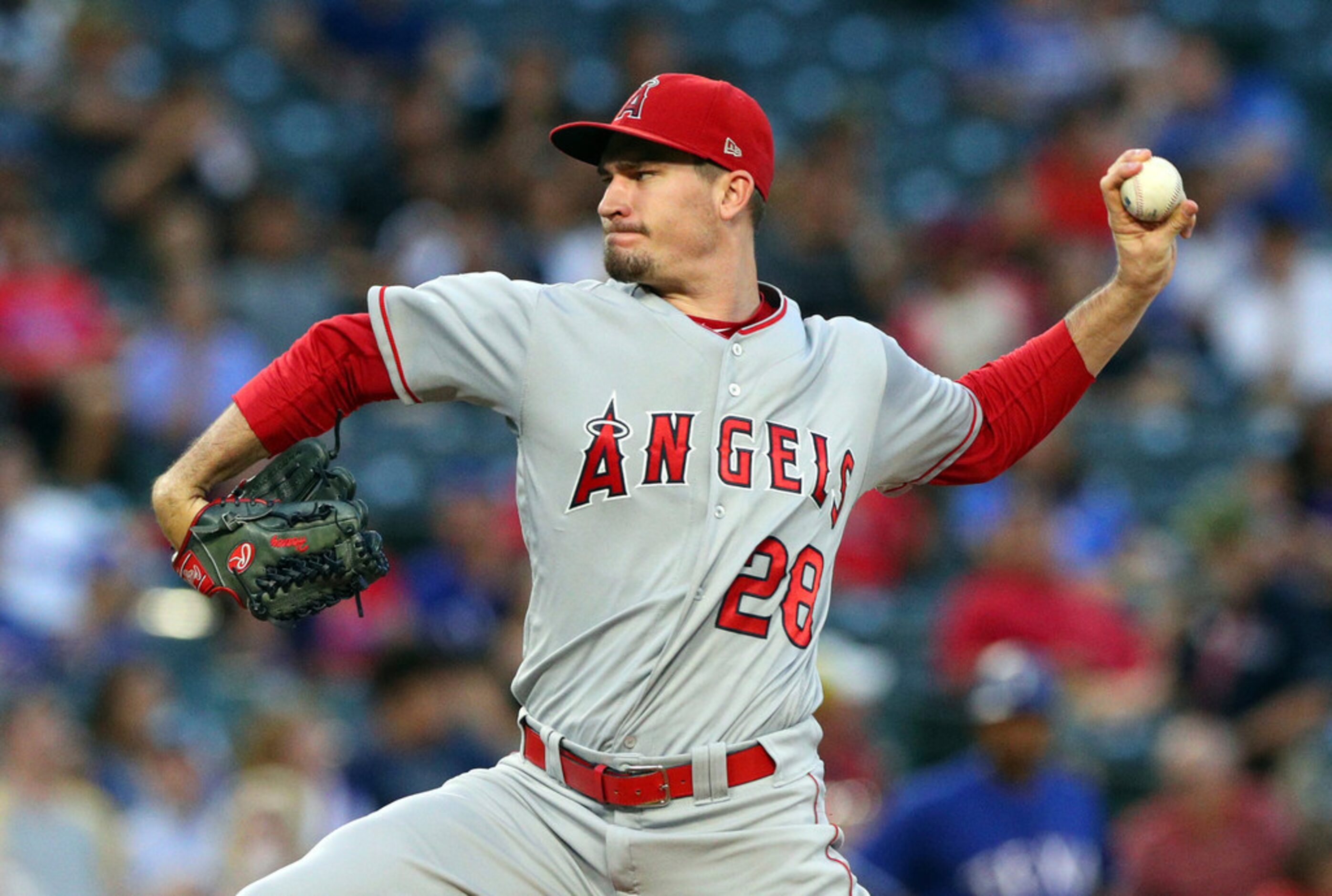 Los Angeles Angels' Andrew Heaney delivers a pitch against the Texas Rangers in the first...