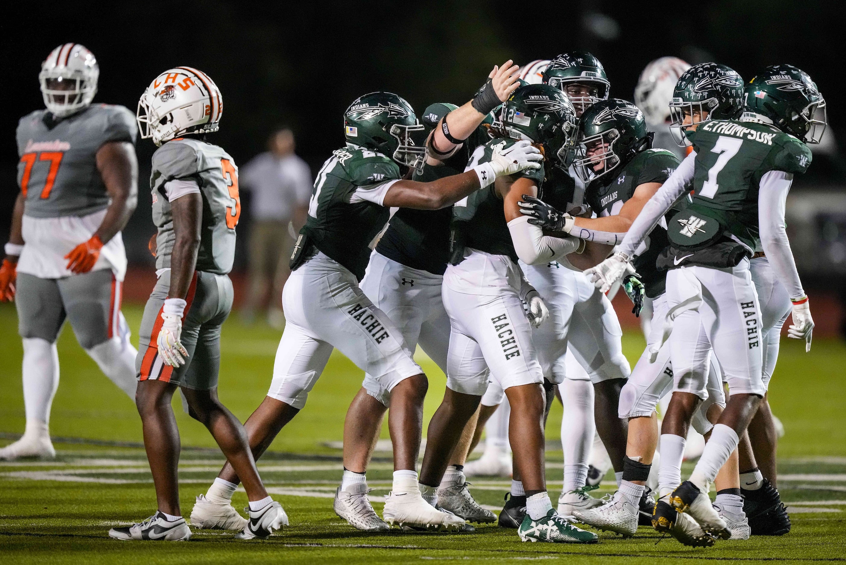 Lancaster quarterback Ja'Quavius Pipkin (3) and offensive lineman Osborne Duncan (77) walk...