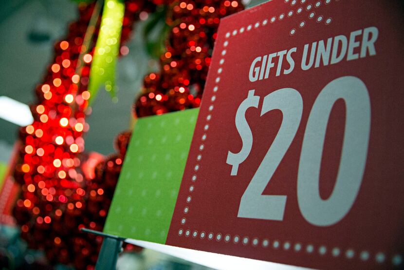 Sale prices hang on a holiday display at a J.C. Penney store in Collin Creek Mall Tuesday,...