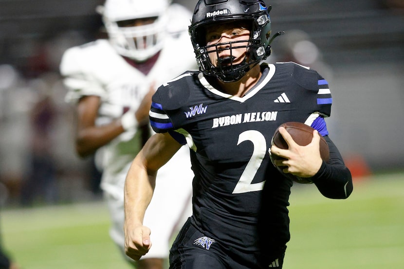 Byron Nelson's Grant Bizjack (2) carries the ball against Lewisville during the second half...