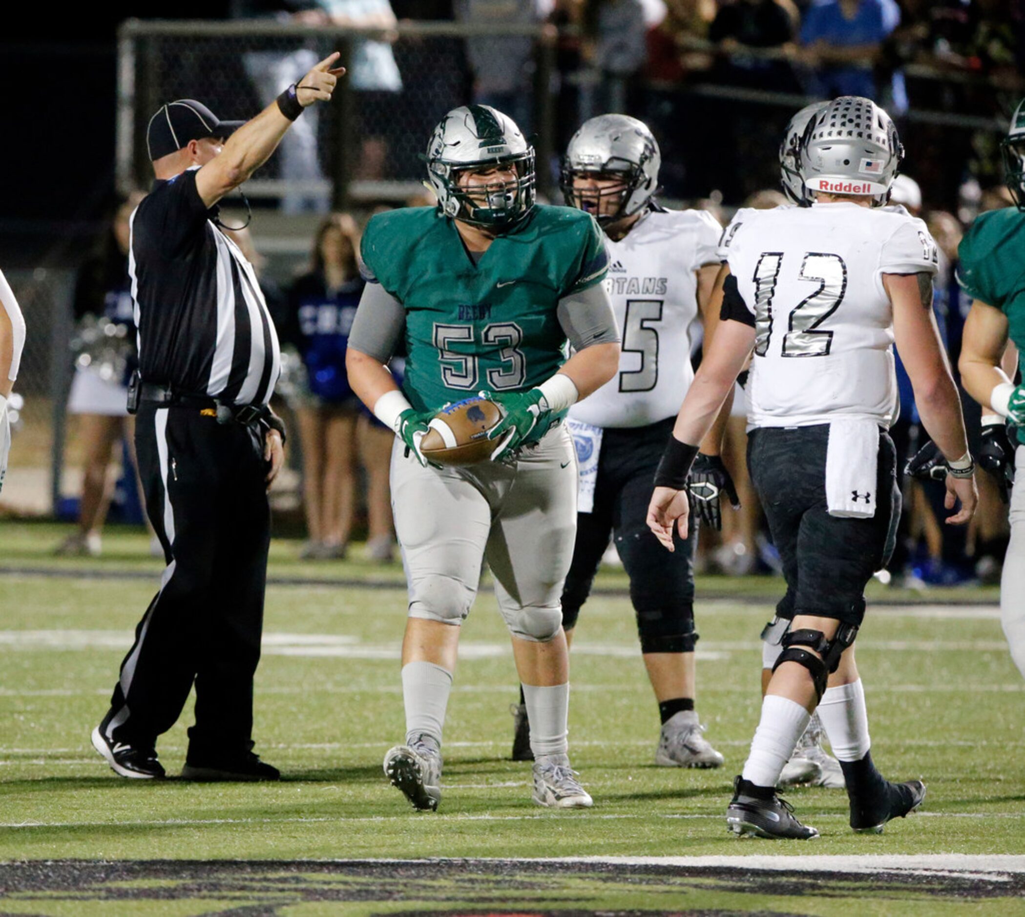 Frisco Reedy defensive tackle (53) recovers a fumble against Burleson Centennial (12) during...