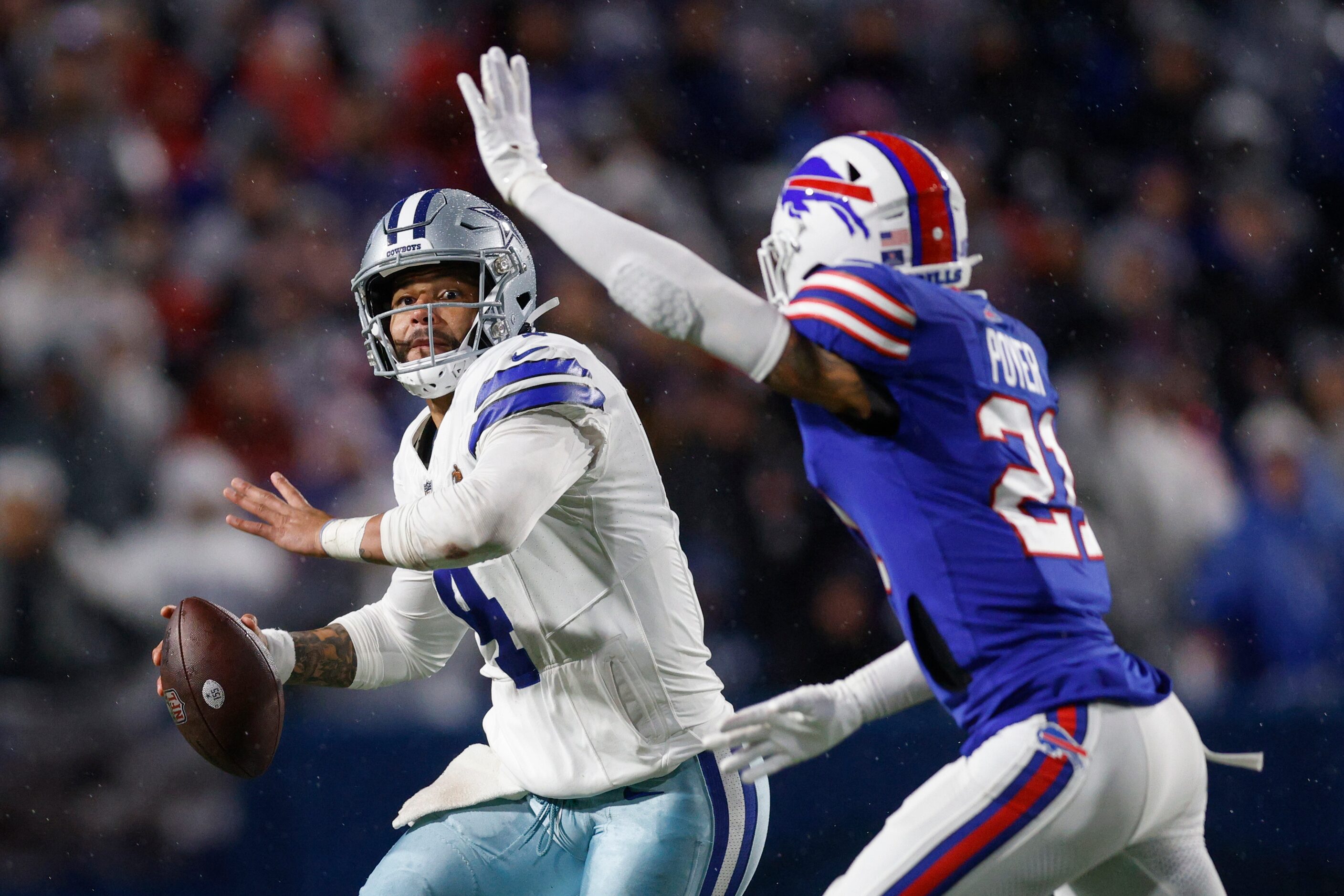 Dallas Cowboys quarterback Dak Prescott (4) throws a pass over Buffalo Bills safety Jordan...