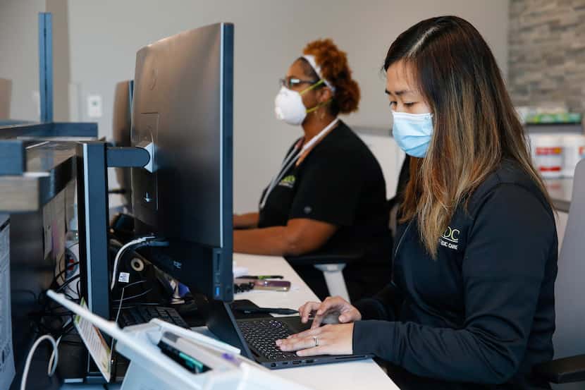 Sherita Mills, radiological technologist, left, and Vanessa Chang, practice manager, work at...