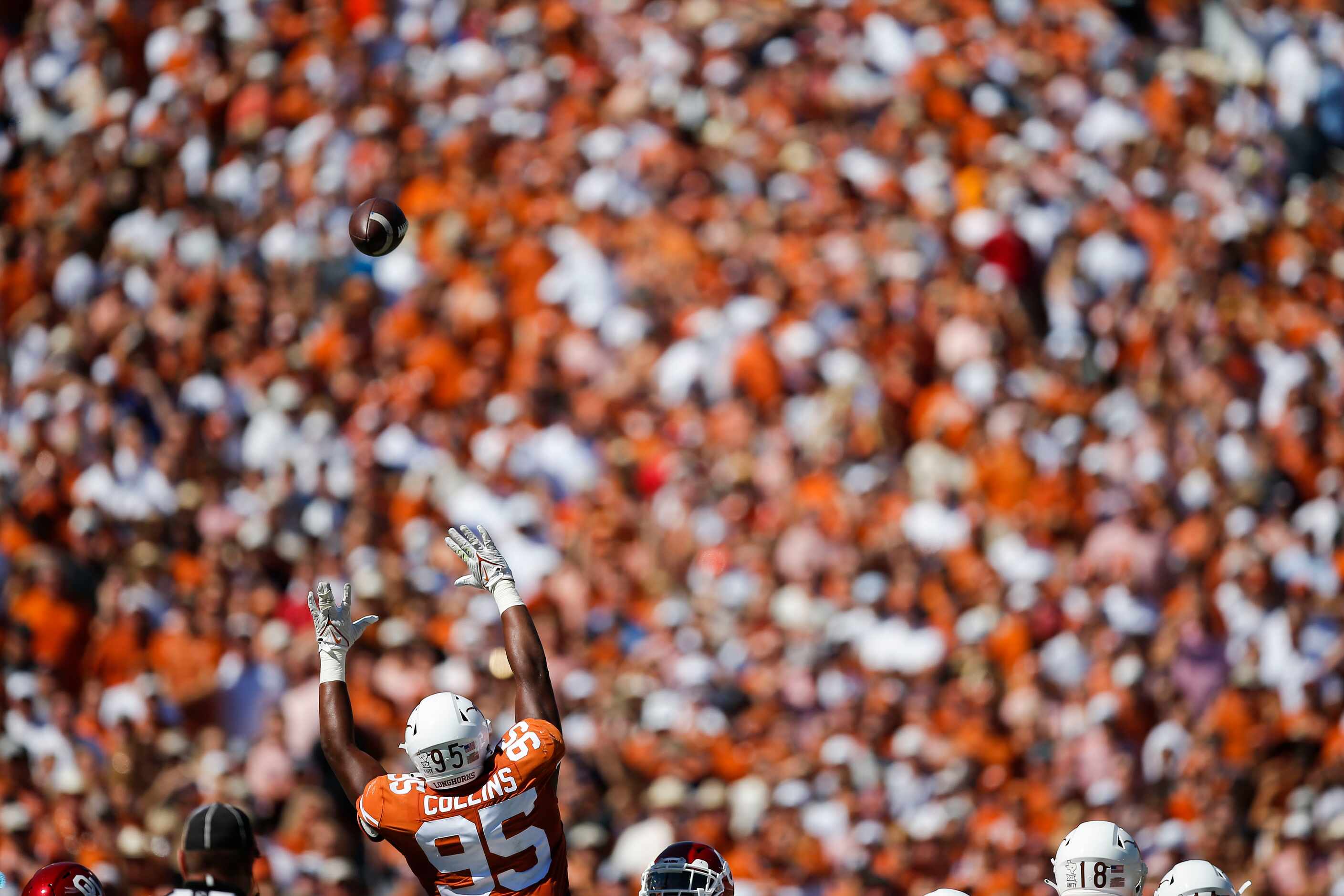 Texas defensive lineman Alfred Collins (95) attempts to block a Oklahoma field goal during...