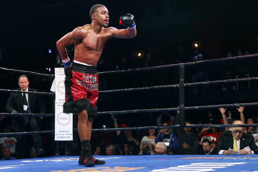 DeSoto boxer Errol Spence Jr, a rising star in the sport, takes a bow after defeating...