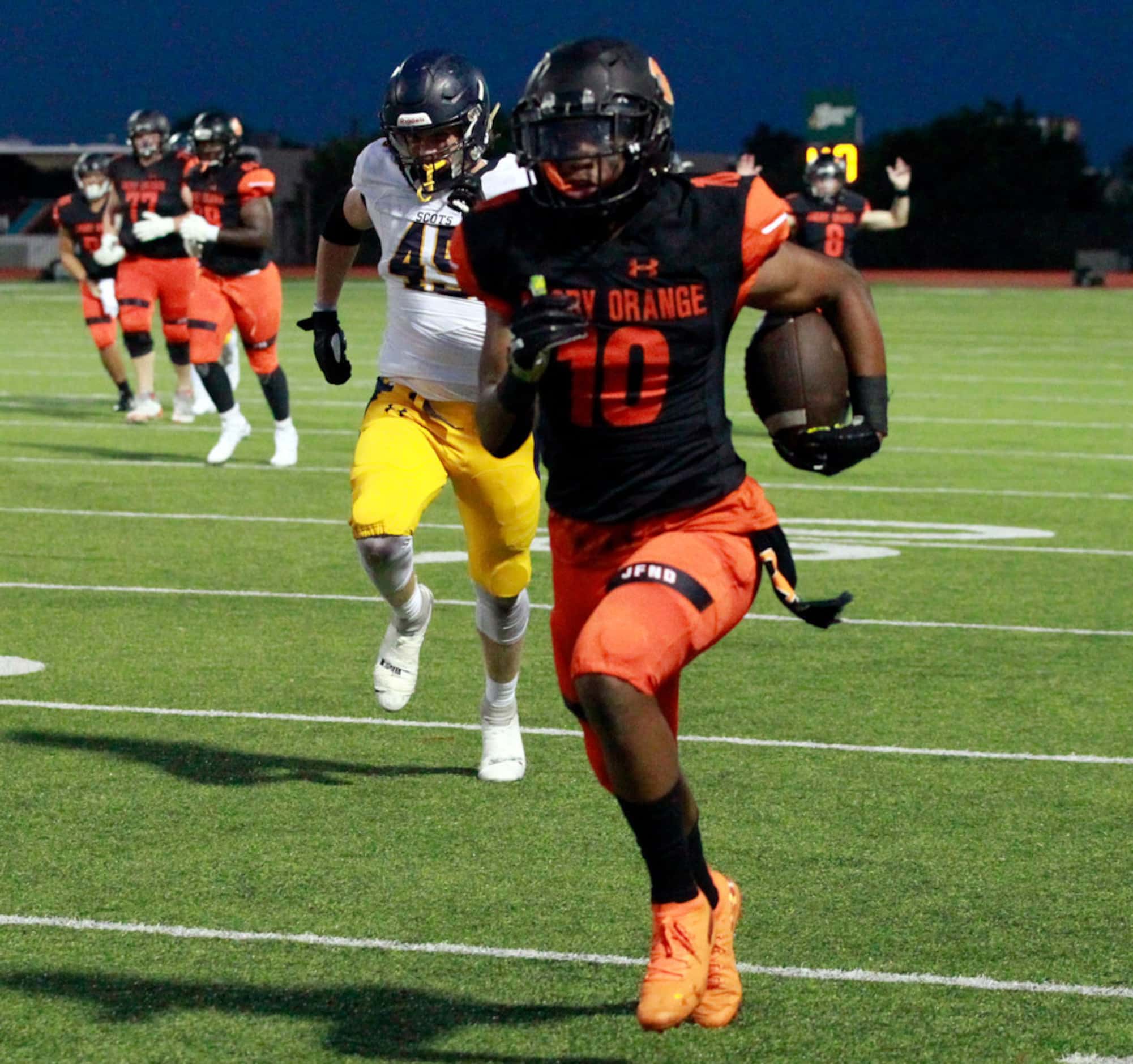 Rockwall WR J.J. Williams (10) heads to the end zone for a touchdown during the first half...