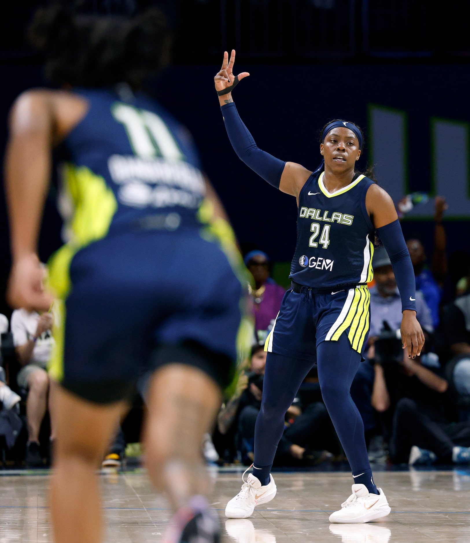 Dallas Wings guard Arike Ogunbowale (24) celebrates a three-point shot during the second...