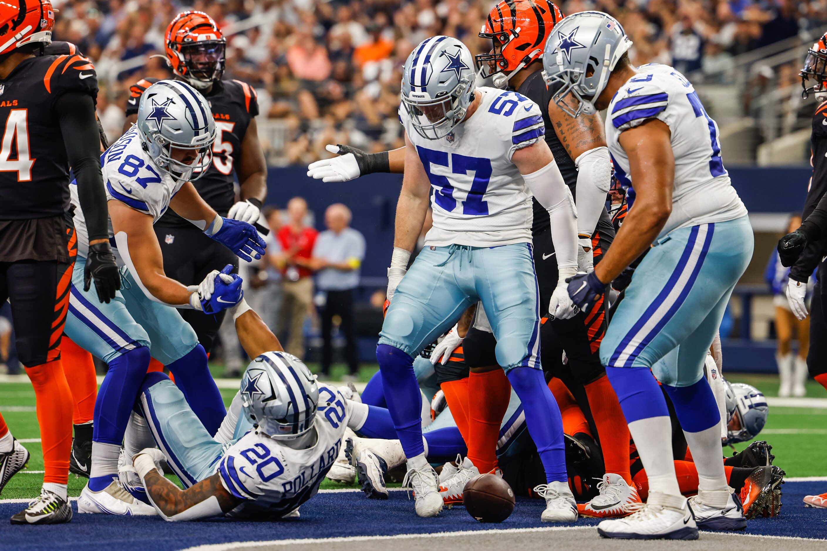 Dallas Cowboys running back Tony Pollard (20) gets celebrated by his team after a touchdown...