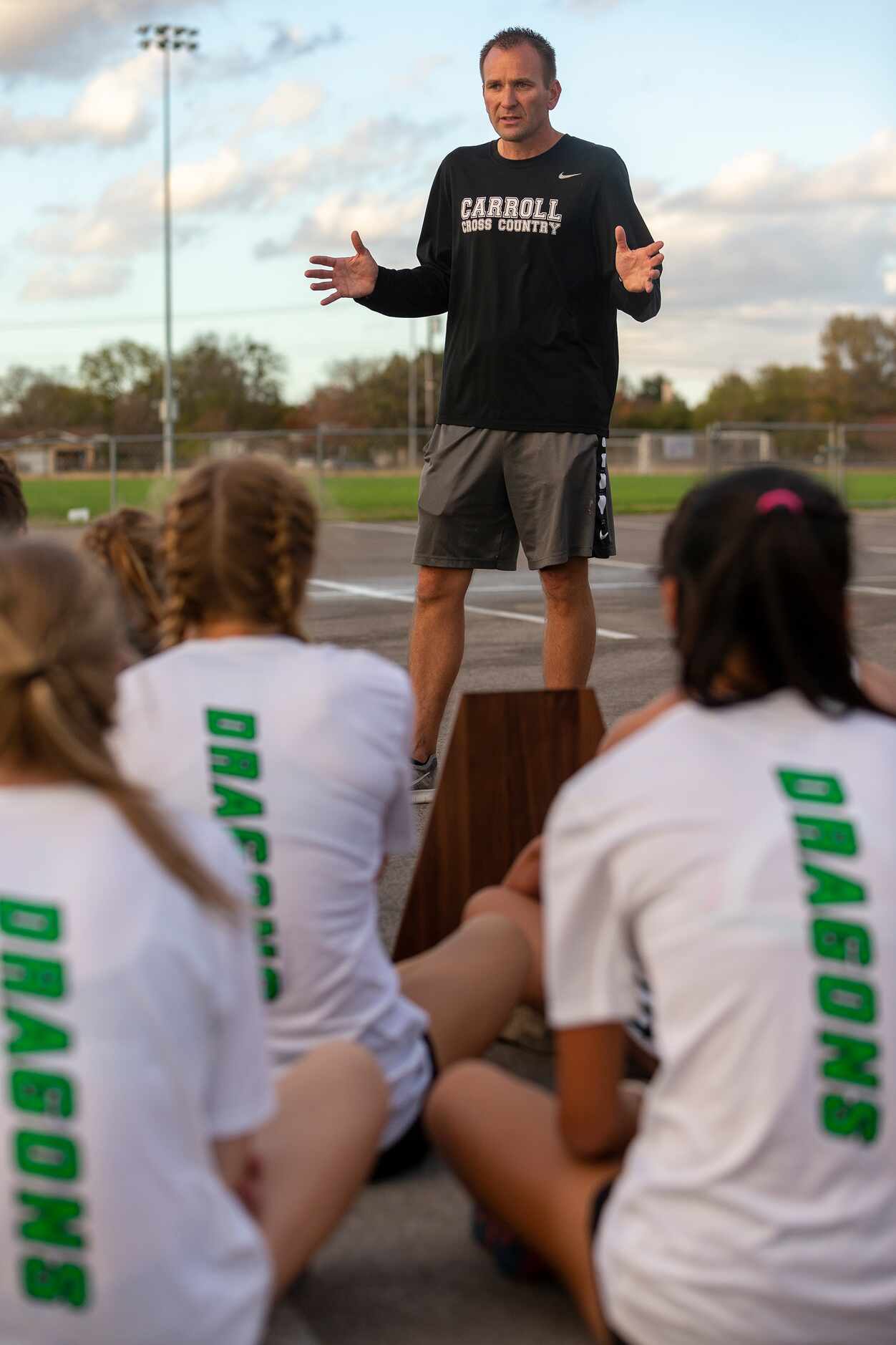 Southlake Carroll coach Justin Leonard speaks with his girls and boys team after finishing...
