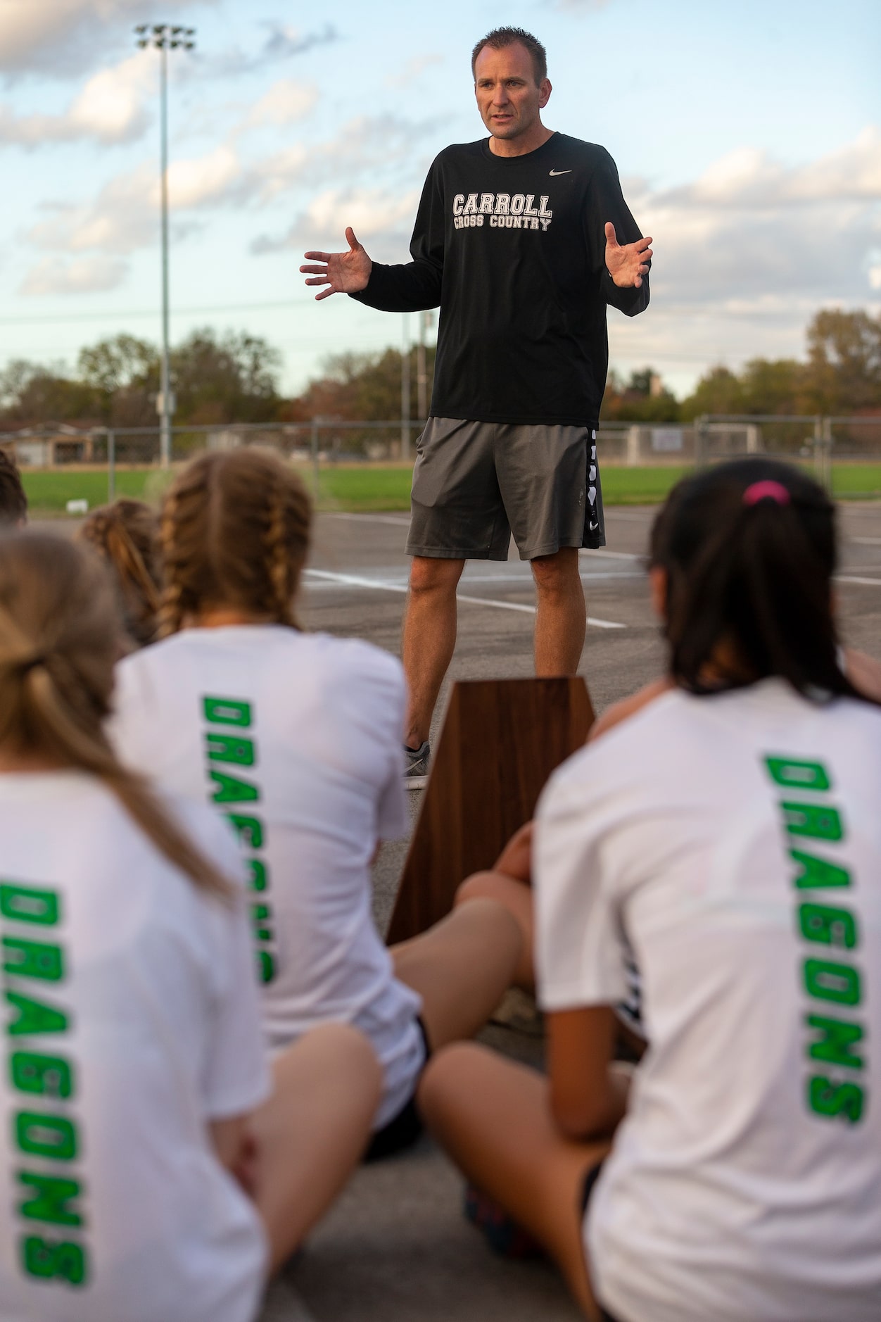 Southlake Carroll coach Justin Leonard speaks with his girls and boys team after finishing...