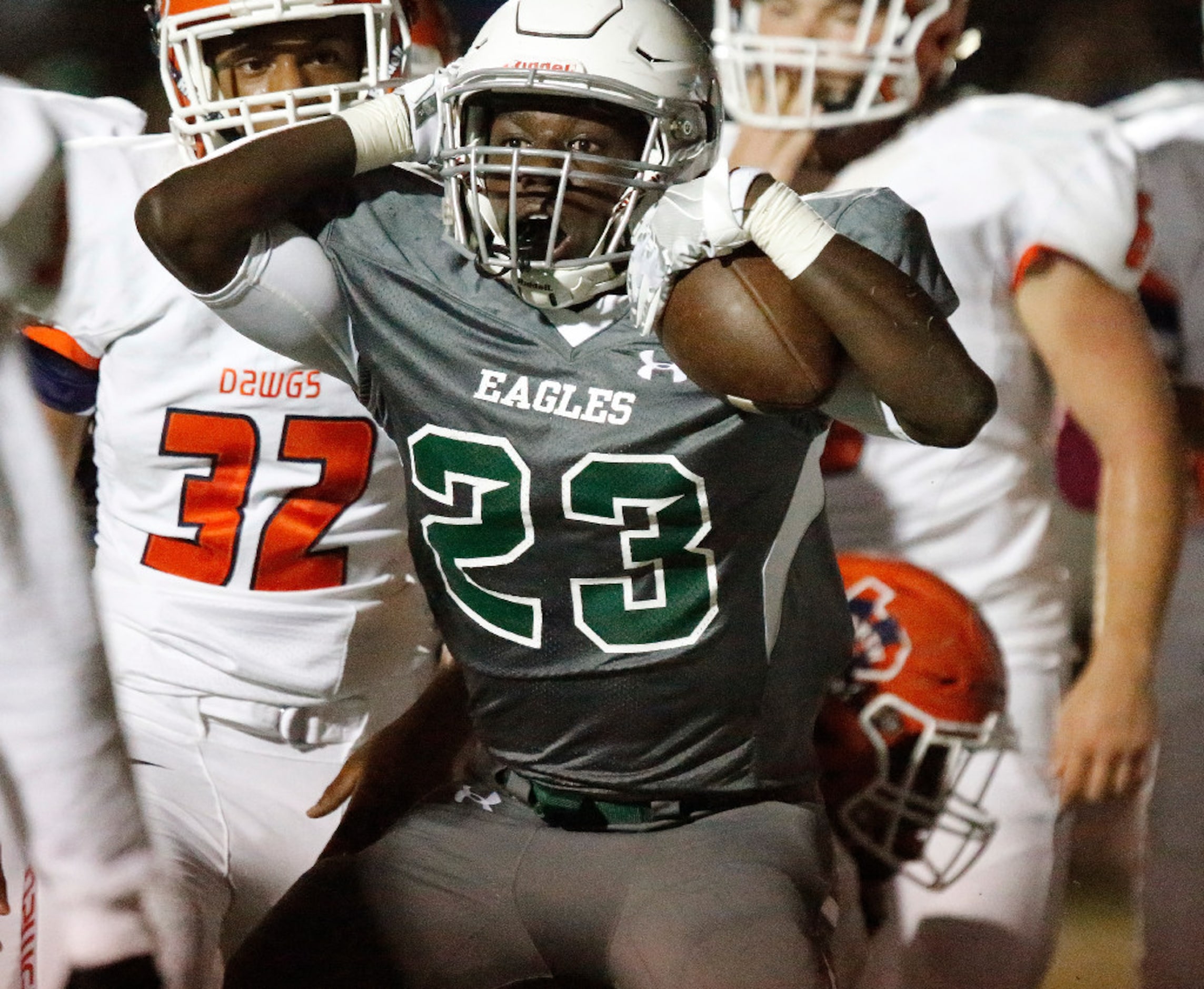 Prosper High School running back Wayne Anderson (23) reacts with disbelief that he was down...