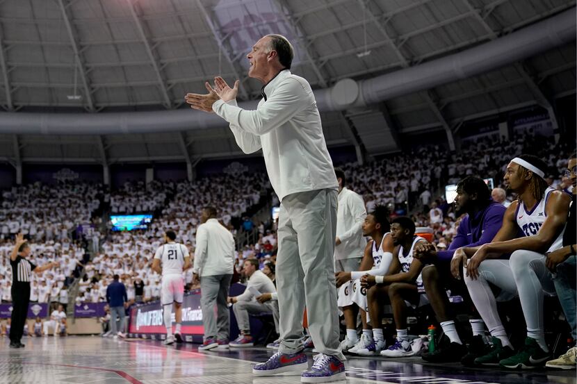 TCU head coach Jamie Dixon instructs his team in the first half of an NCAA college...