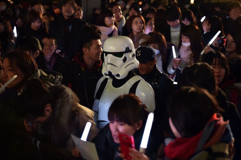  A fan dressed as a Stormtrooper is seen amid other fans as they gather for a promotional...