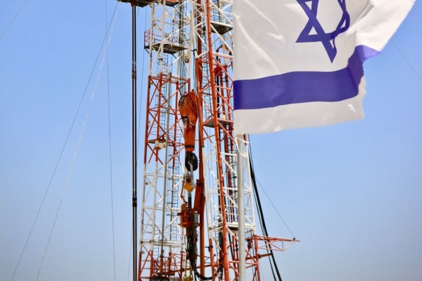 An Israeli flag flies next to the Megiddo-Jezreel #1 well drilled by Zion Oil & Gas. This is...