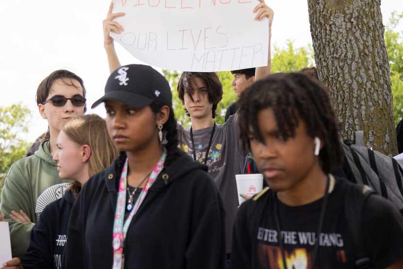 Allen High School students participate in a walkout over gun violence in Allen on Thursday,...