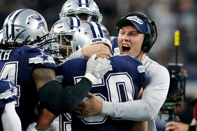 Dallas Cowboys injured outside linebacker Leighton Vander Esch (right) congratulates outside...