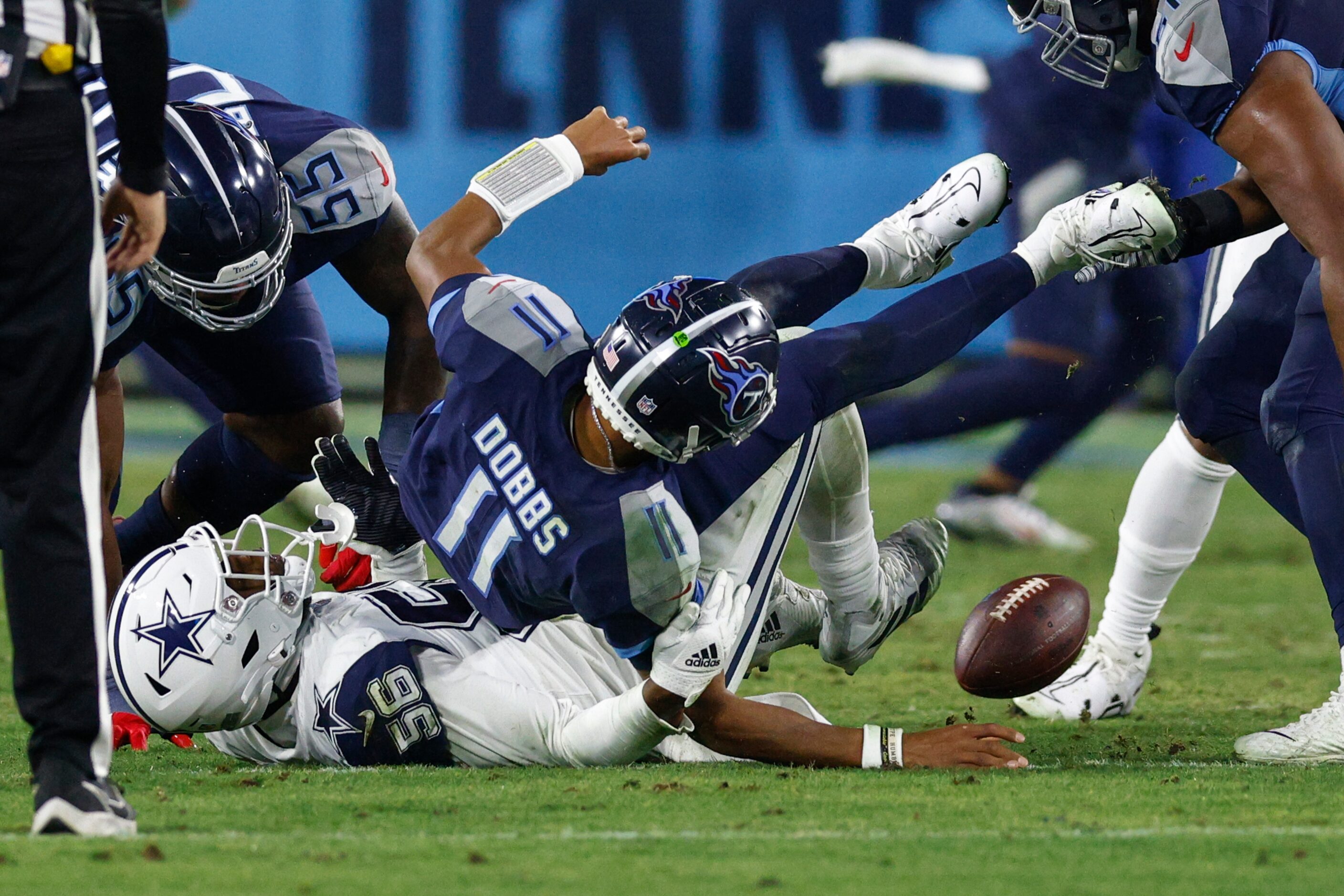 Dallas Cowboys defensive end Dante Fowler Jr. (56) forces a fumble from Tennessee Titans...