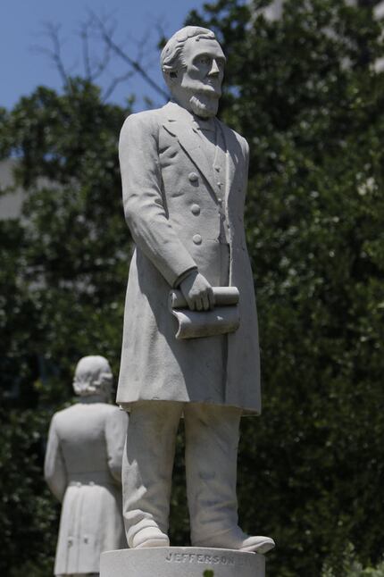 A Jefferson Davis statue stands next to a Confederate memorial in Pioneer Park Cemetery in...