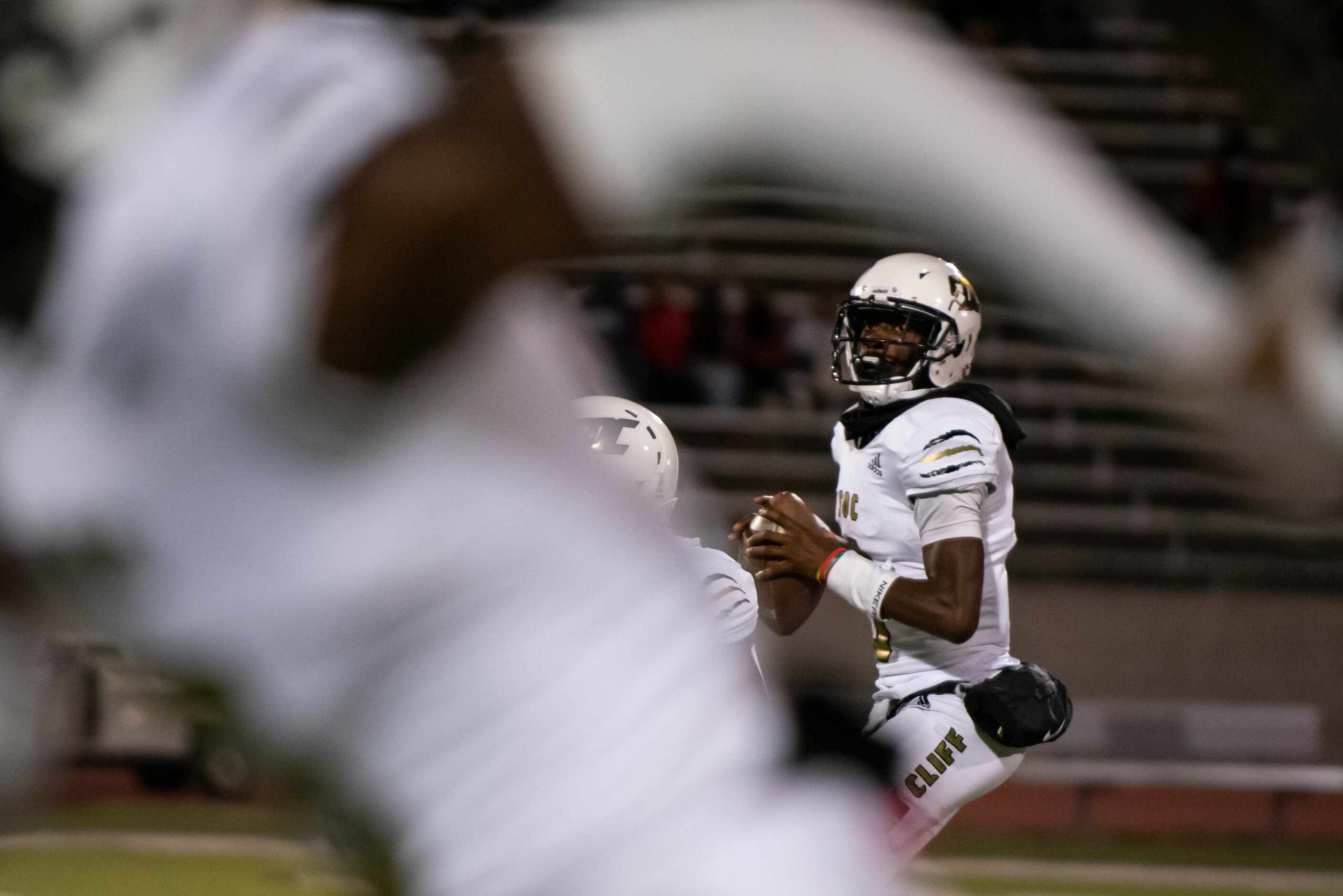 South Oak Cliff senior Kevin Henry-Jennings (8) drops back in the pocket to find an open...