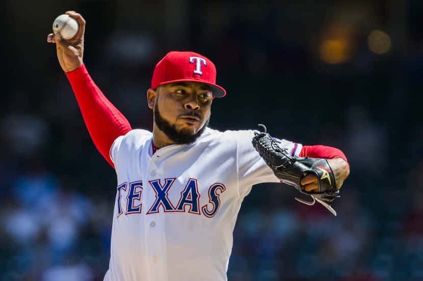 Texas Rangers relief pitcher Jeremy Jeffress (23) pitches during the seventh inning of their...