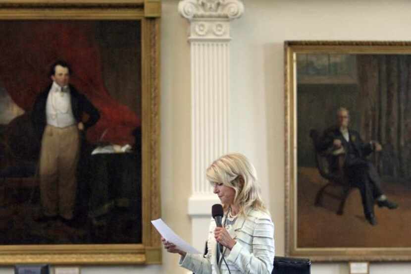 
State Sen. Wendy Davis launched into the third hour of her 11-hour filibuster to halt...