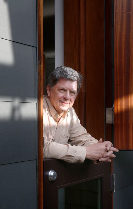 Architect Dan Shipley poses in one of the Dutch doors whose top and bottom panels swing...