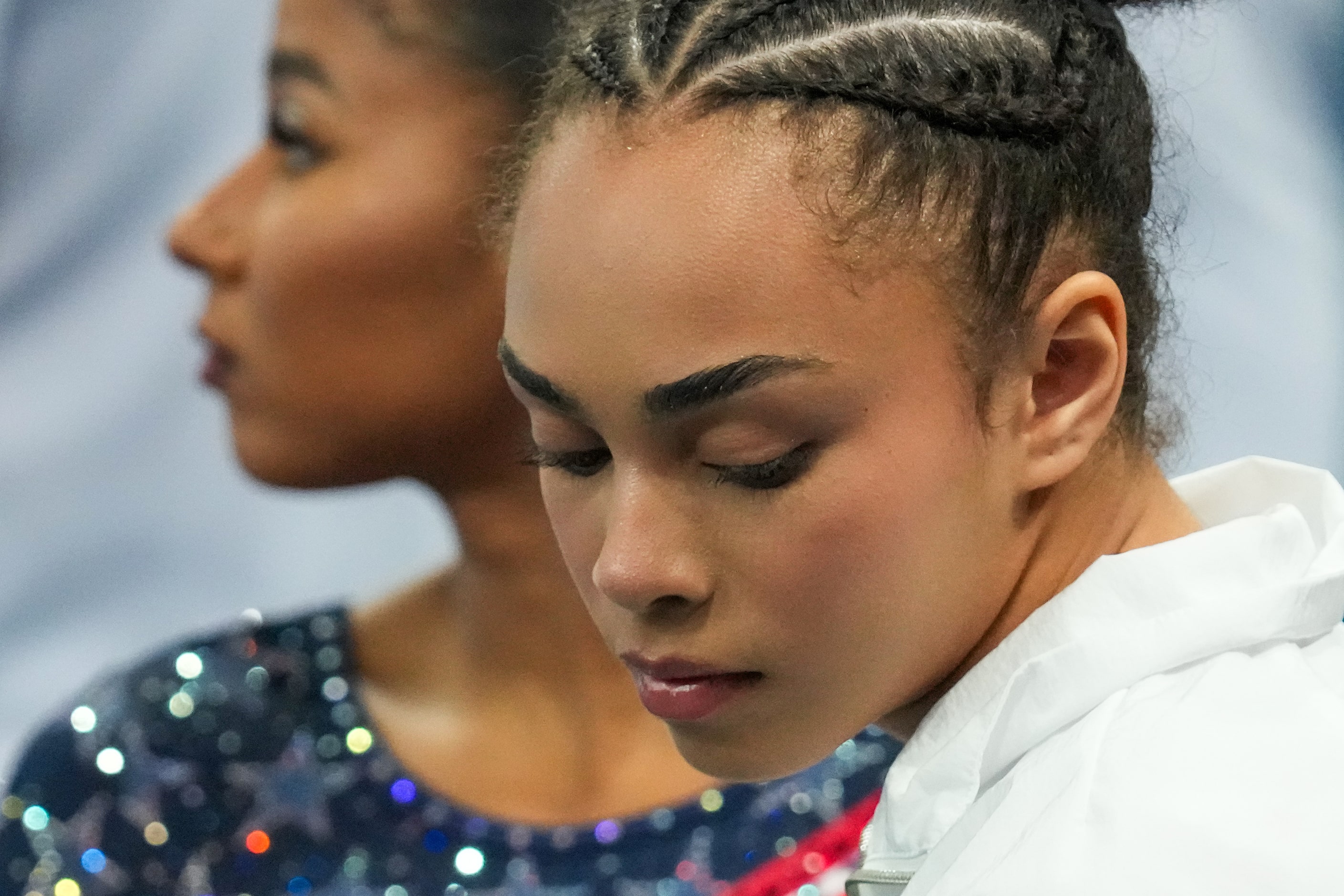 Hezly Rivera of the United States watches from the sidelines during the women’s gymnastics...