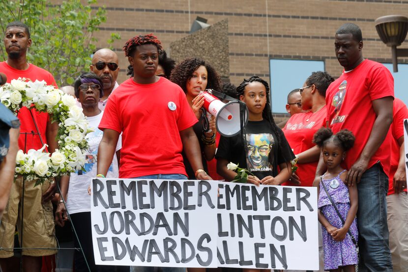 Sara Mokuria spoke with a bullhorn at rally held on the steps of the Frank Crowley Courts...