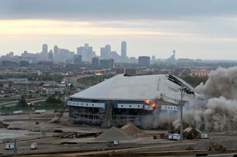 The implosion of Texas Stadium at about the halfway point, seen from the University of...