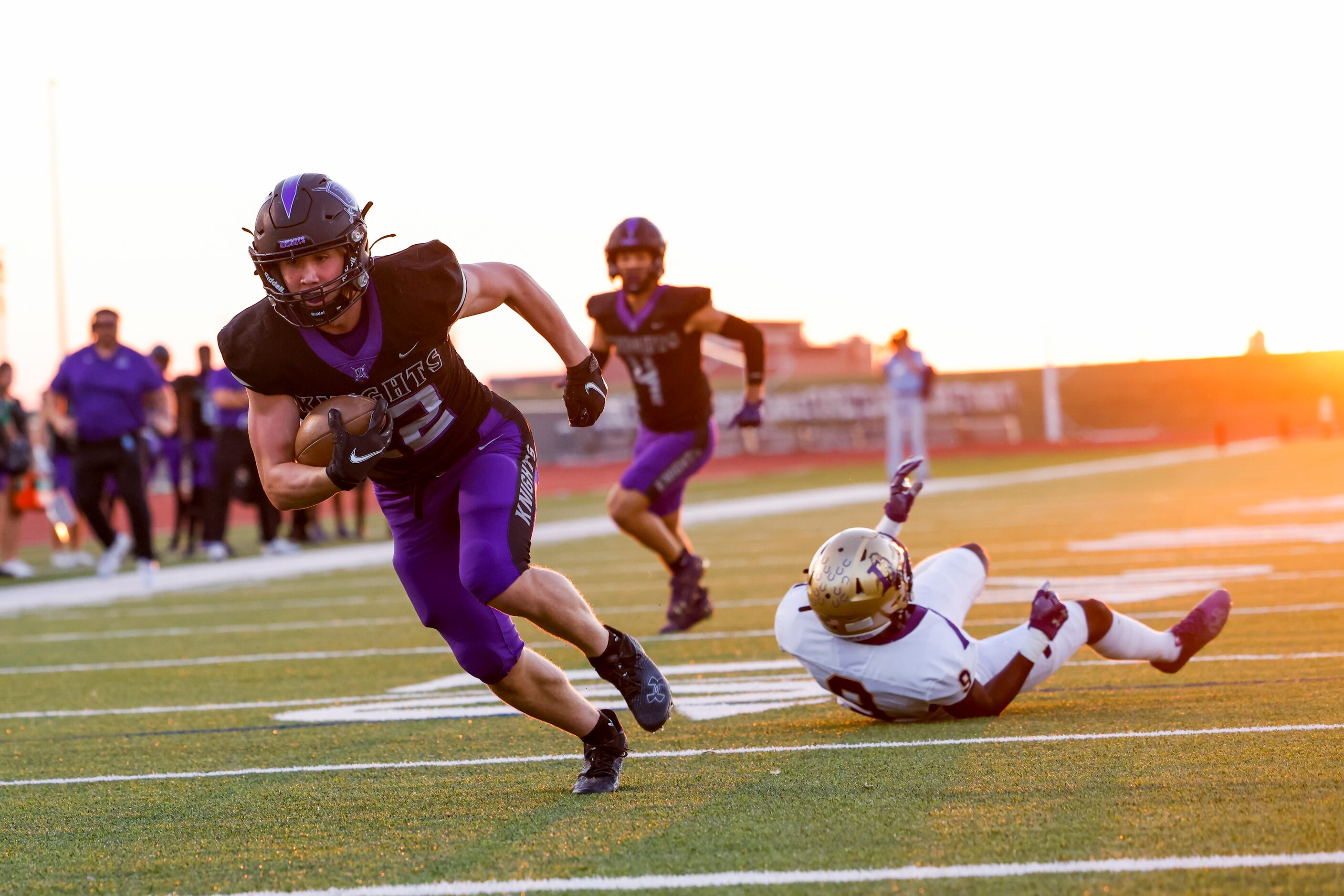 Frisco Independence’s Austin Call (22) evades Denton’s cornerback Kit Mongo (9) as he runs...