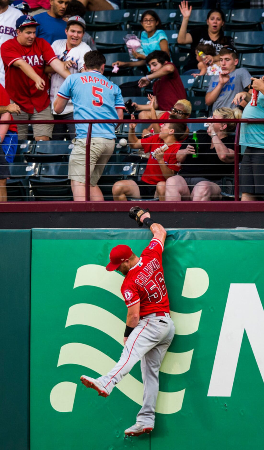 Los Angeles Angels right fielder Kole Calhoun (56) fails to catch a home run hit by Texas...