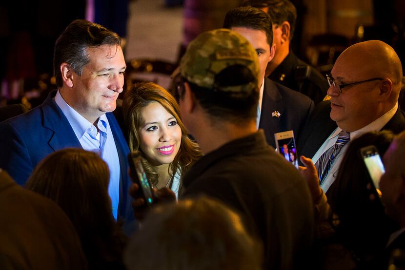 Sen. Ted Cruz poses for photos with supporters during a campaign event at River Ranch...