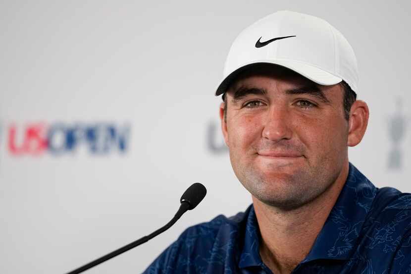 Scottie Scheffler speaks during a news conference before the U.S. Open Championship golf...