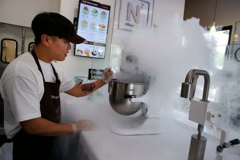 Jong Ha mixes cream with liquid nitrogen at Creamistry in Addison on April 9, 2018.