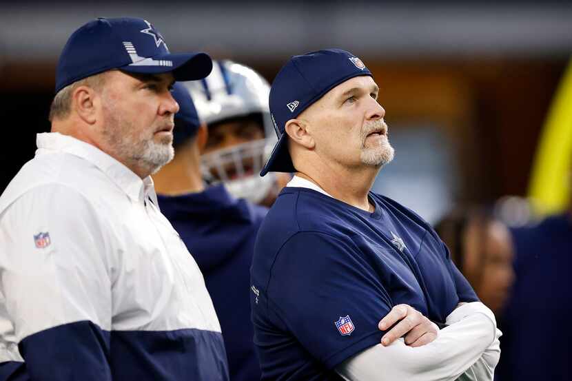 Dallas Cowboys head coach Mike McCarthy (left) and defensive coordinator Dan Quinn watch...