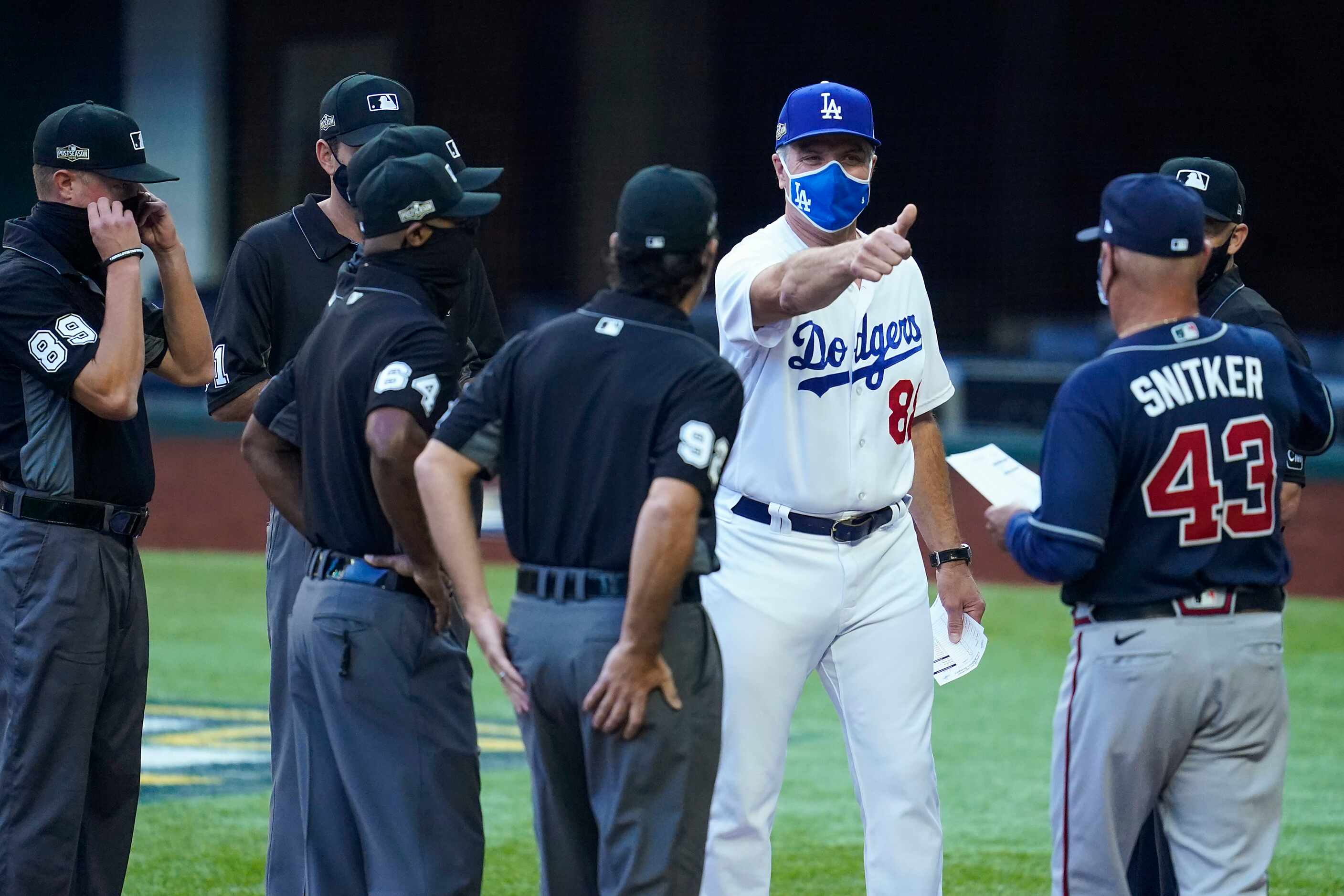 Los Angeles Dodgers bench coach Bob Geren (88) gives a thumbs up to Atlanta Braves manager...