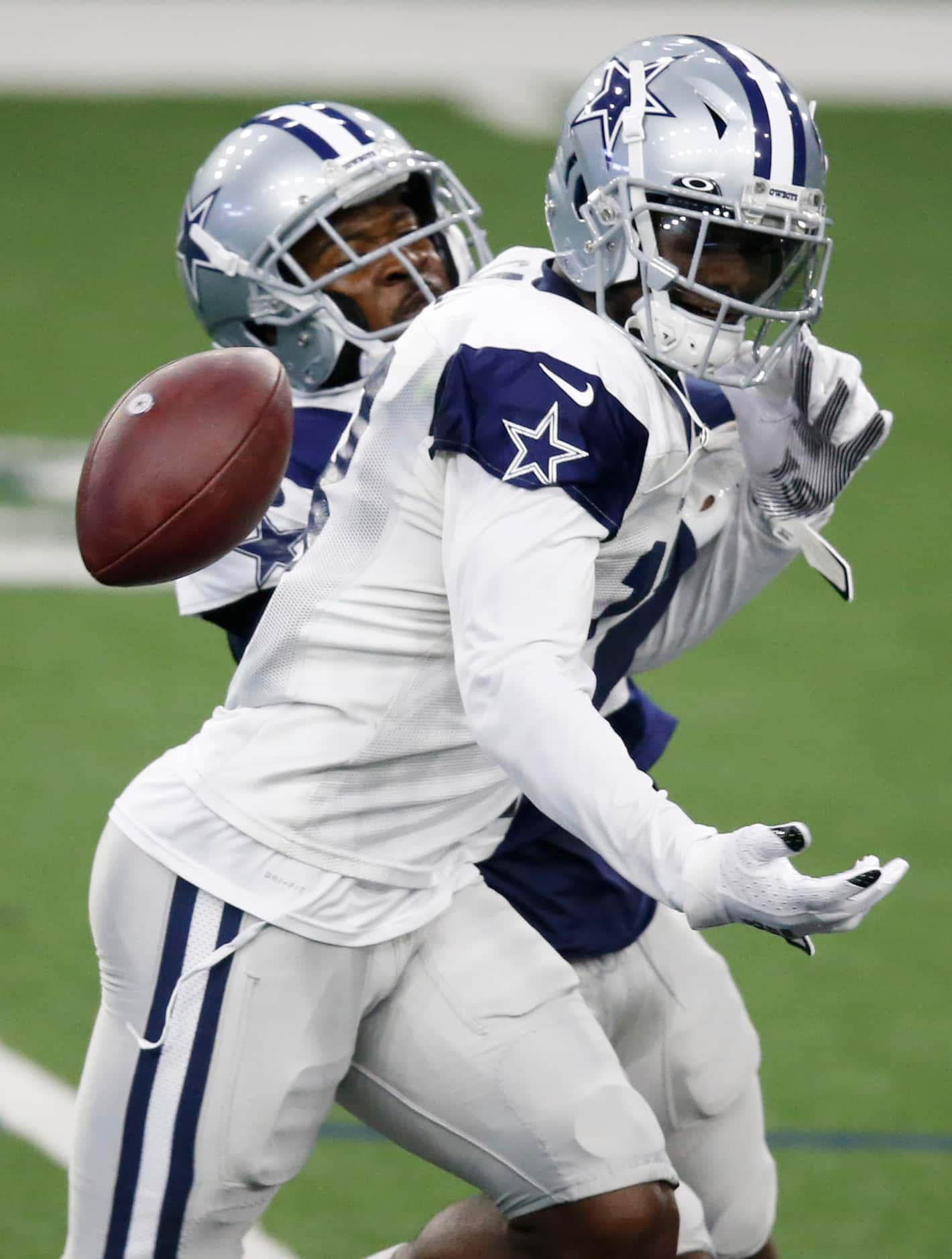 Dallas Cowboys cornerback Anthony Brown (30) punches the ball out of the hands of Dallas...