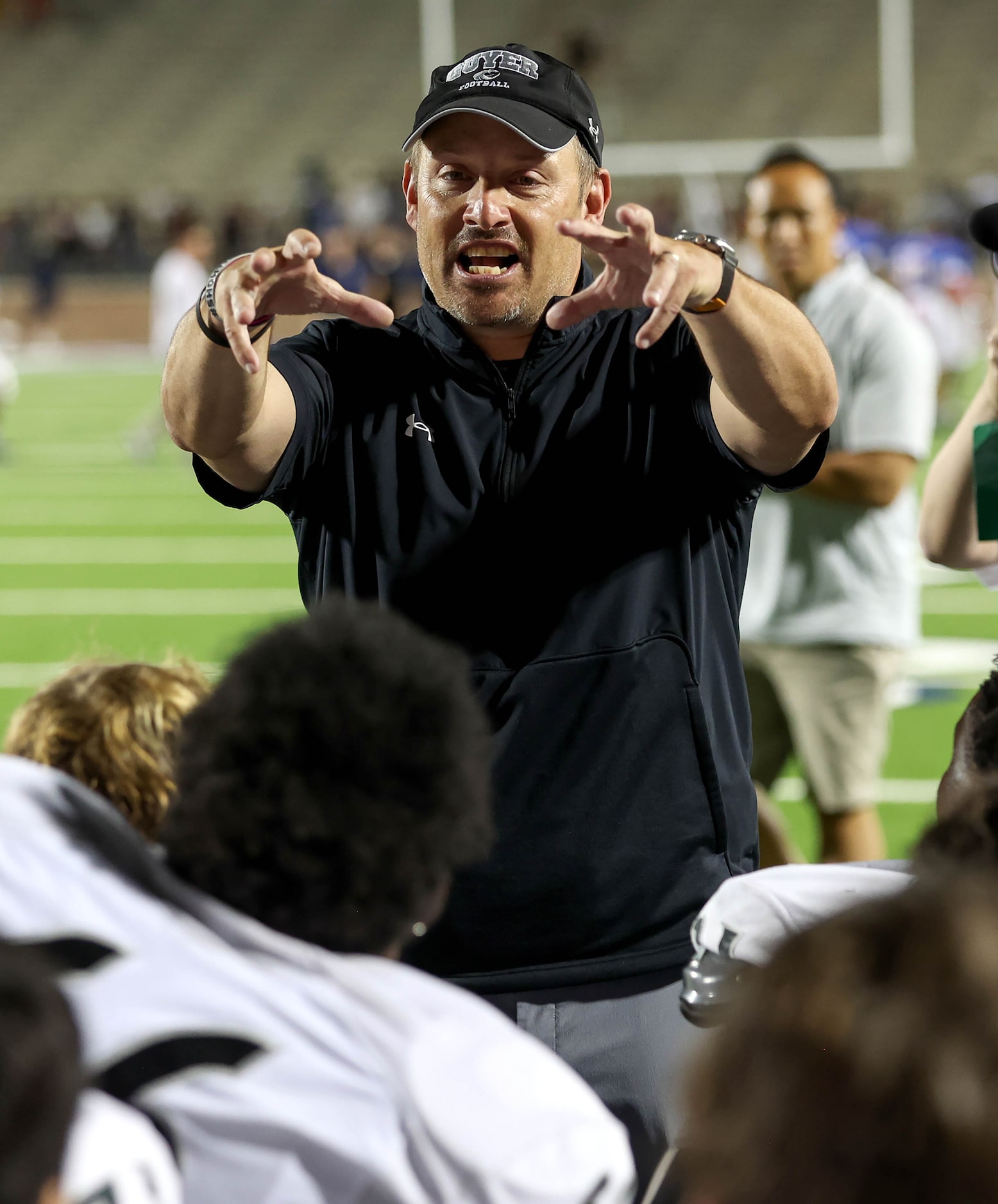 Denton Guyer head coach Reed Heim talks to his team after beating Allen, 24-18 in a District...