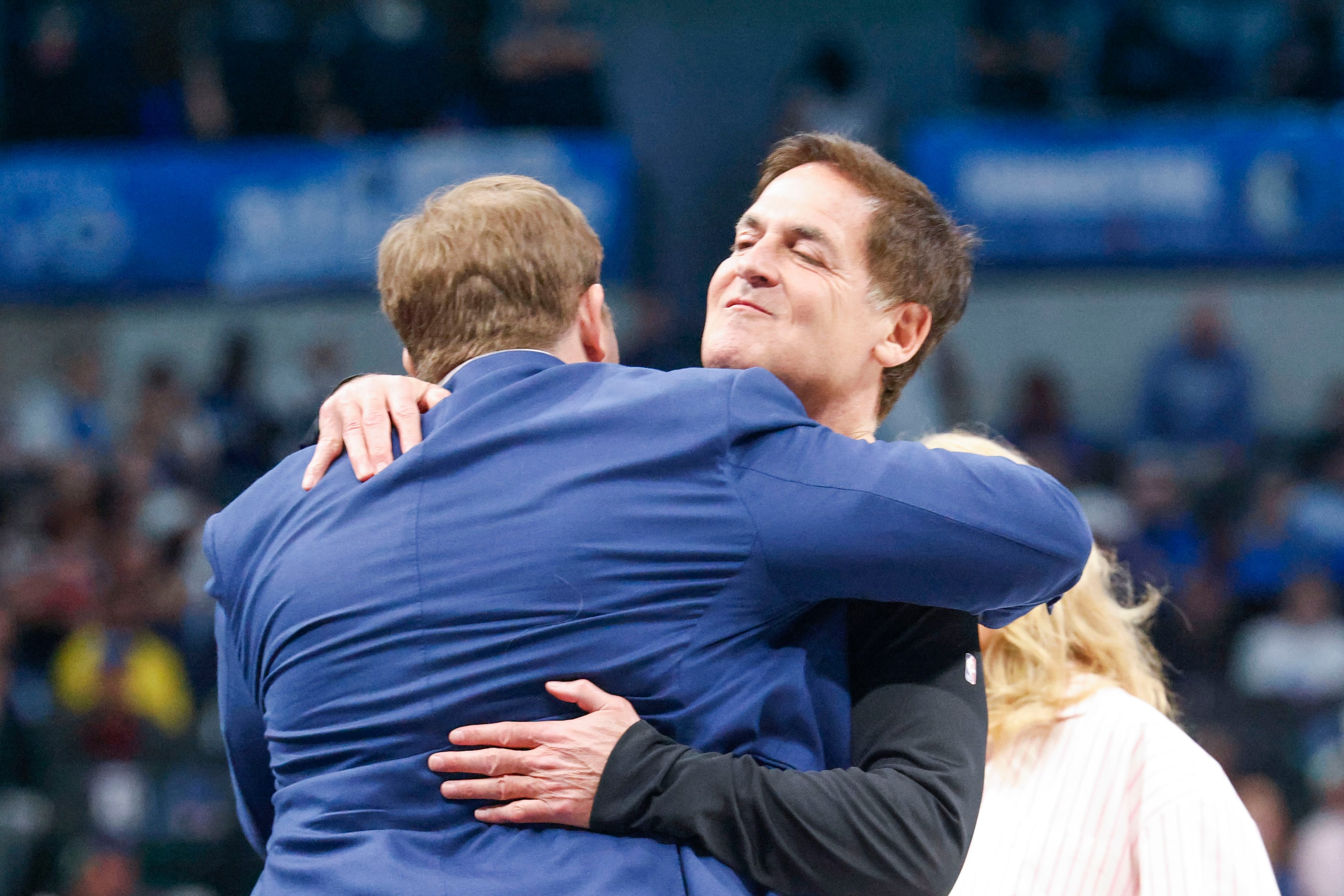 Mavericks Governor Patrick Dumont (front), embraces Dallas Mavericks alternate Governor Mark...