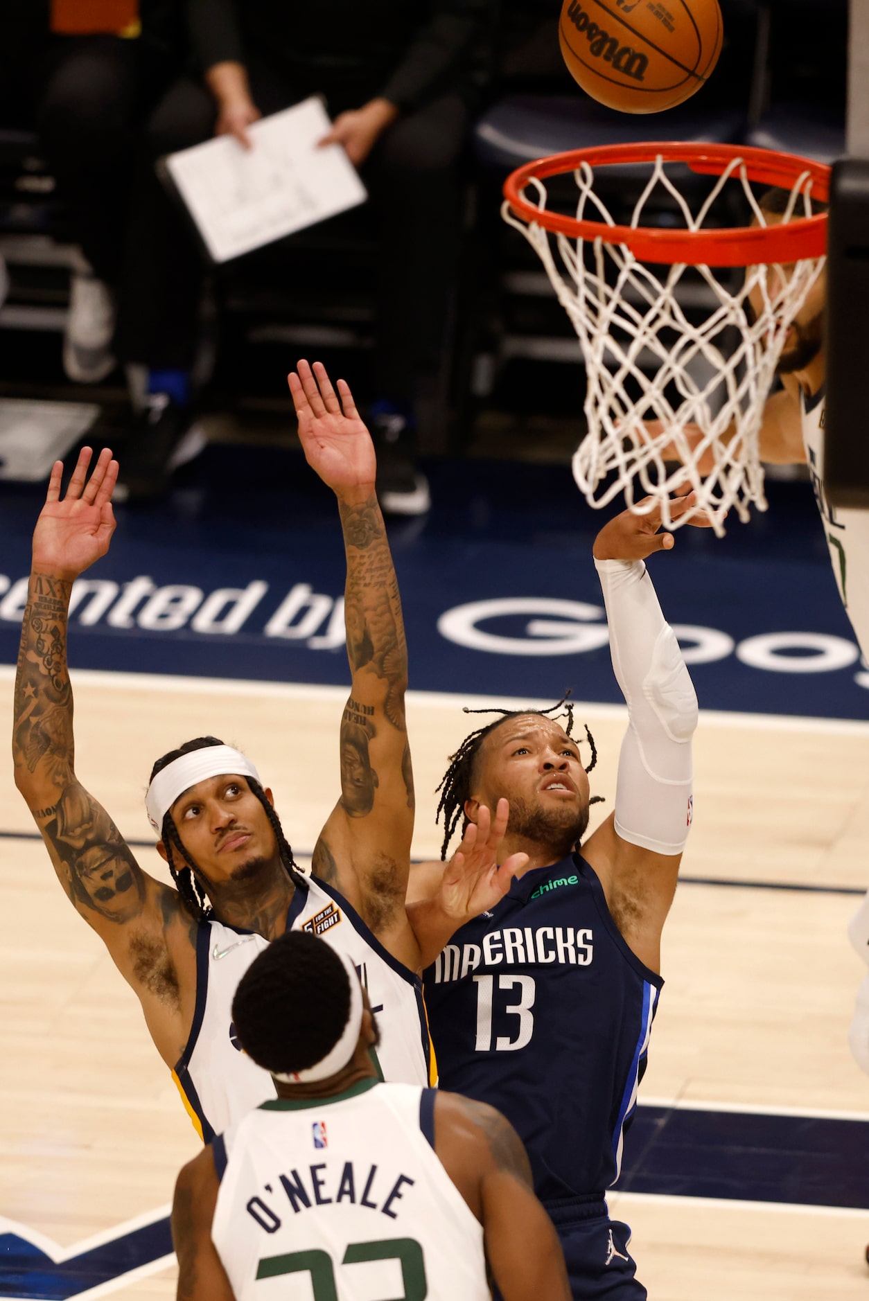 Dallas Mavericks guard Jalen Brunson (13) is fouled as he takes a shot in front of Utah Jazz...