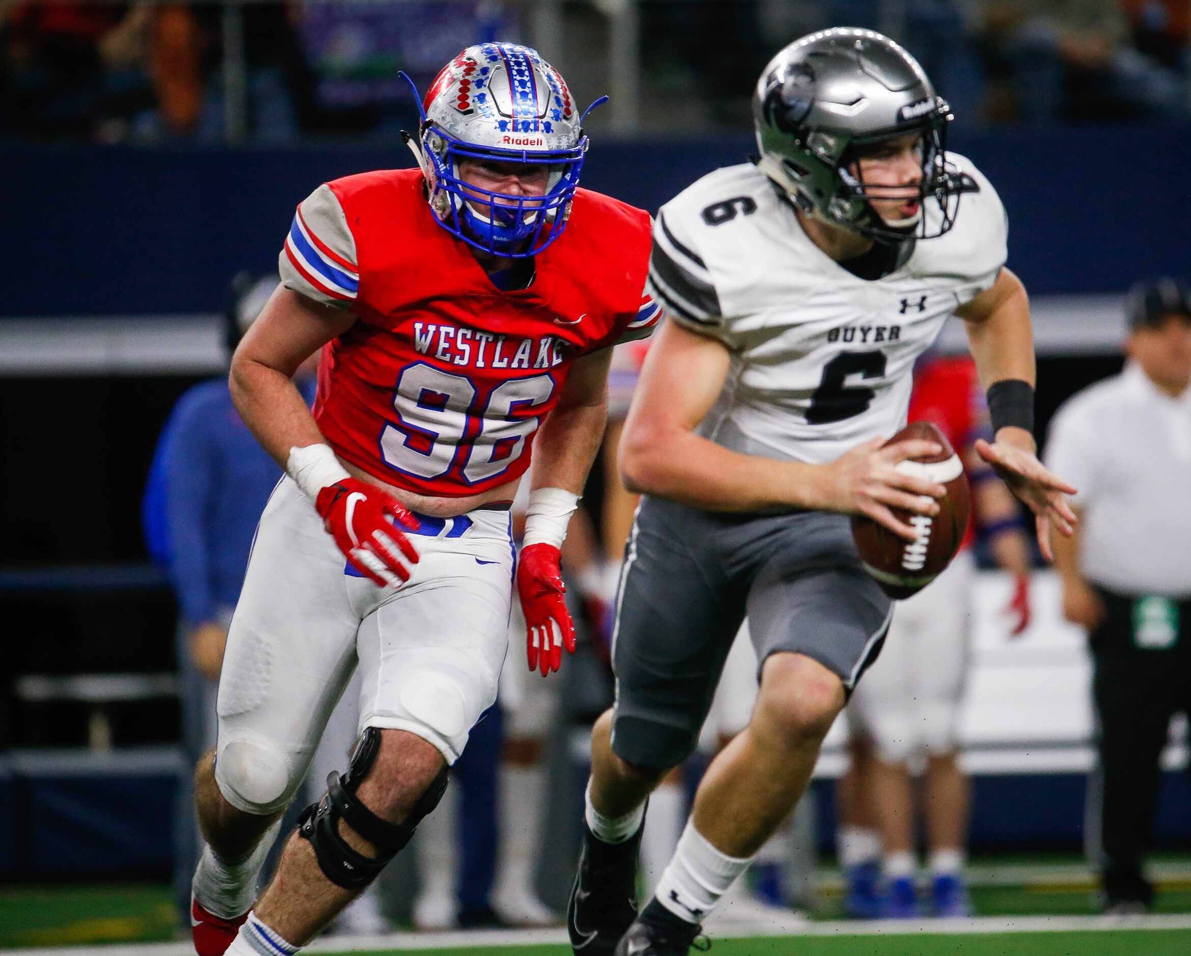Westlake's Austin McClendon (96) charges after Denton Guyer's QB Jackson Arnold (6) in the...