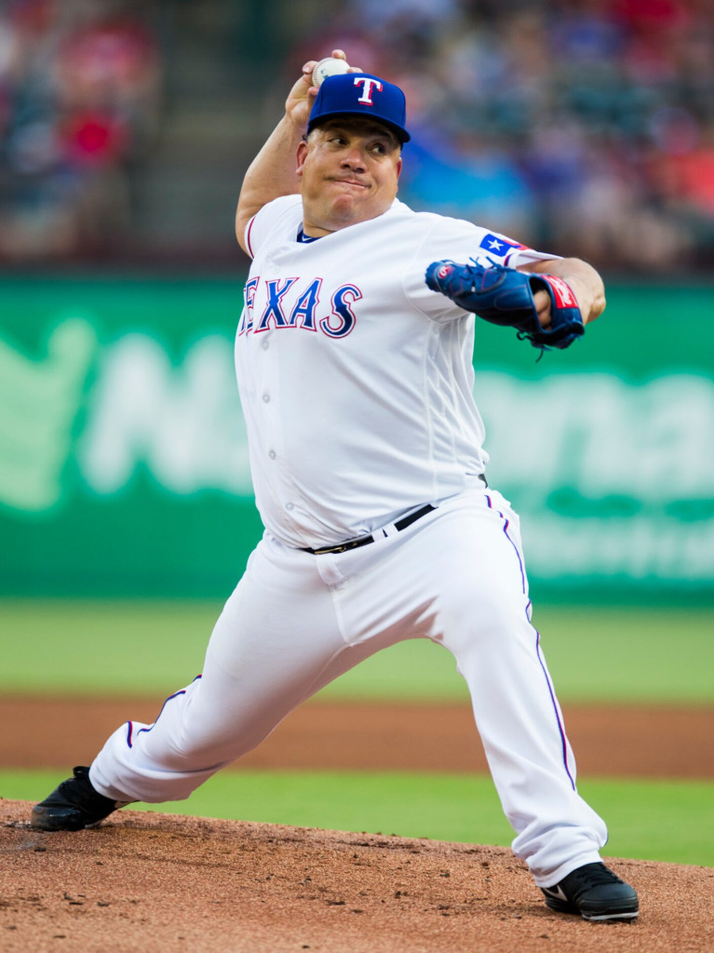 Texas Rangers starting pitcher Bartolo Colon (40) pitches during the first inning of an MLB...