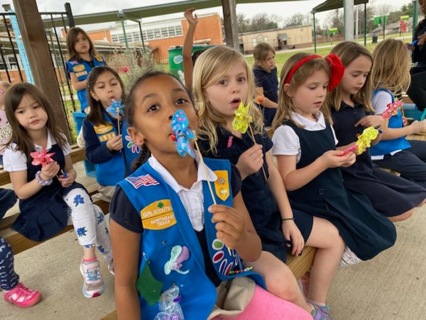 Members of two Dallas Girl Scouts troops, based out of Kramer Elementary, practice different...