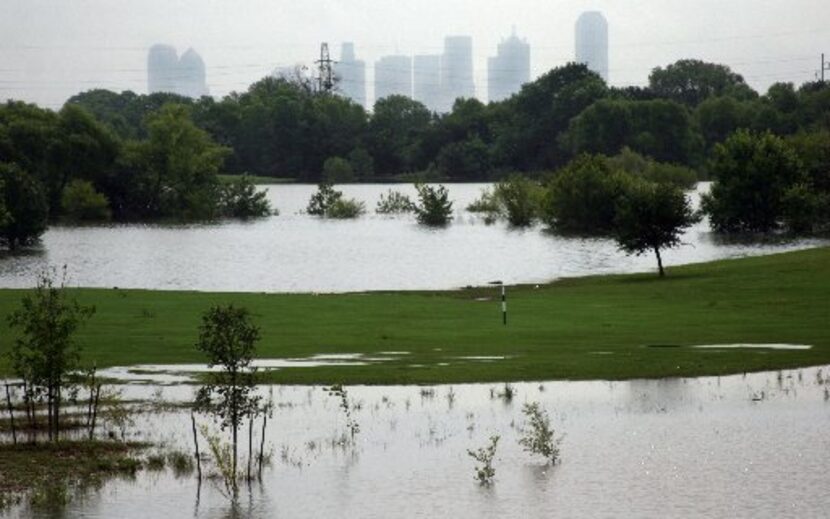 The fairway on the first hole at Twin Wells Golf Course in South Irving, after flooding in...