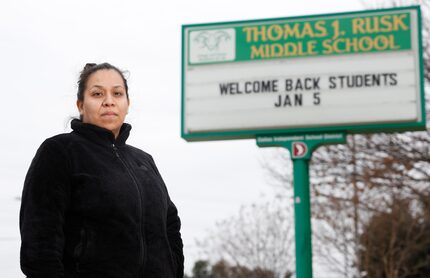 Marilu Gonzalez, parent of a sixth grader, poses for a portrait in front of Thomas J Rusk...